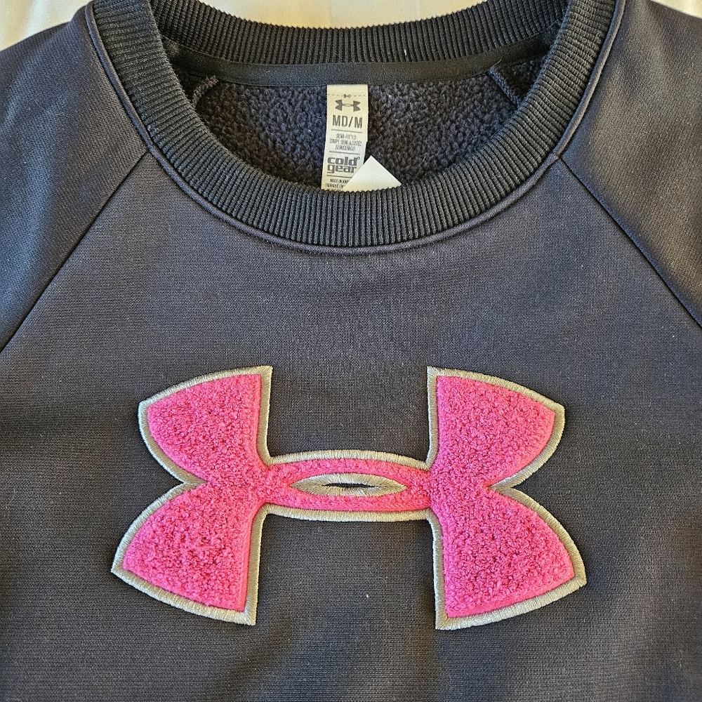 Under Armour Storm cold gear woman’s medium pullover sweatshirt black pink